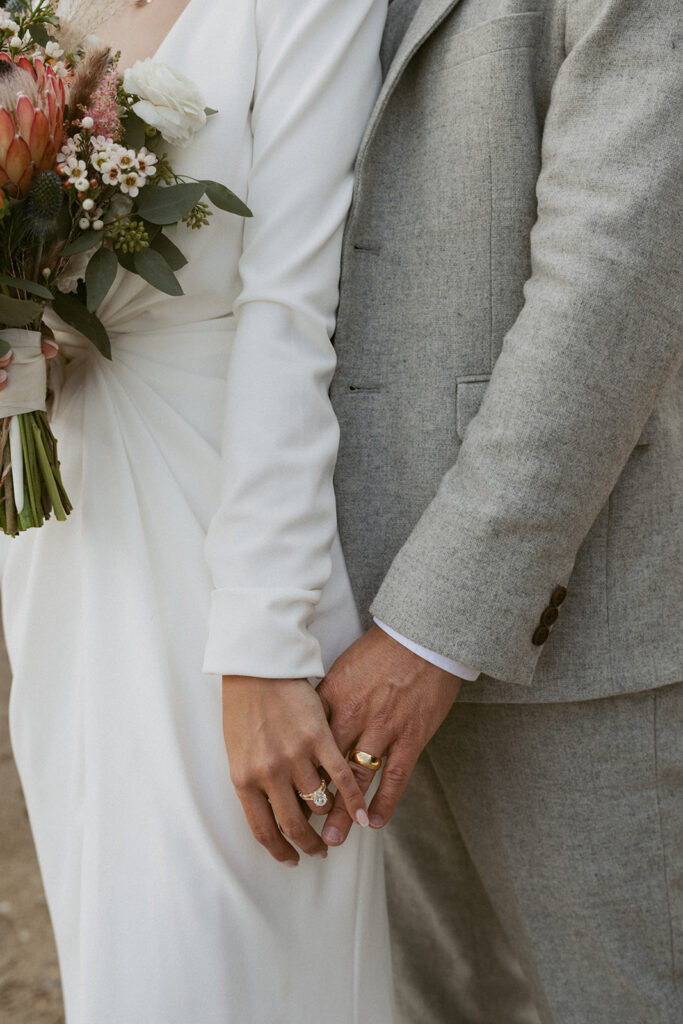 cute couple holding hands during their photoshoot