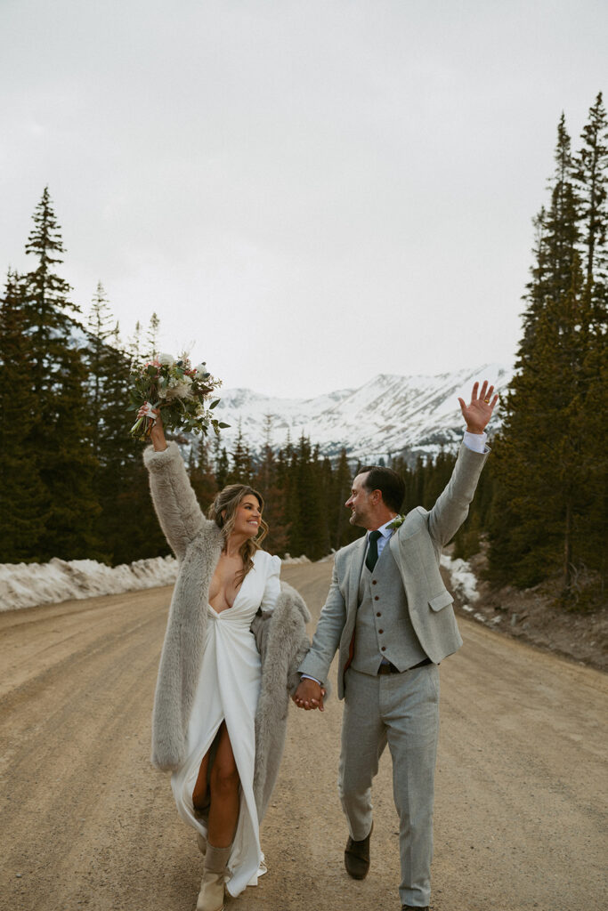 happy couple heading to their reception in colorado