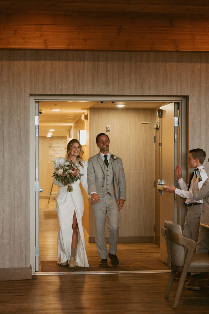 cute couple arriving at their reception in colorado