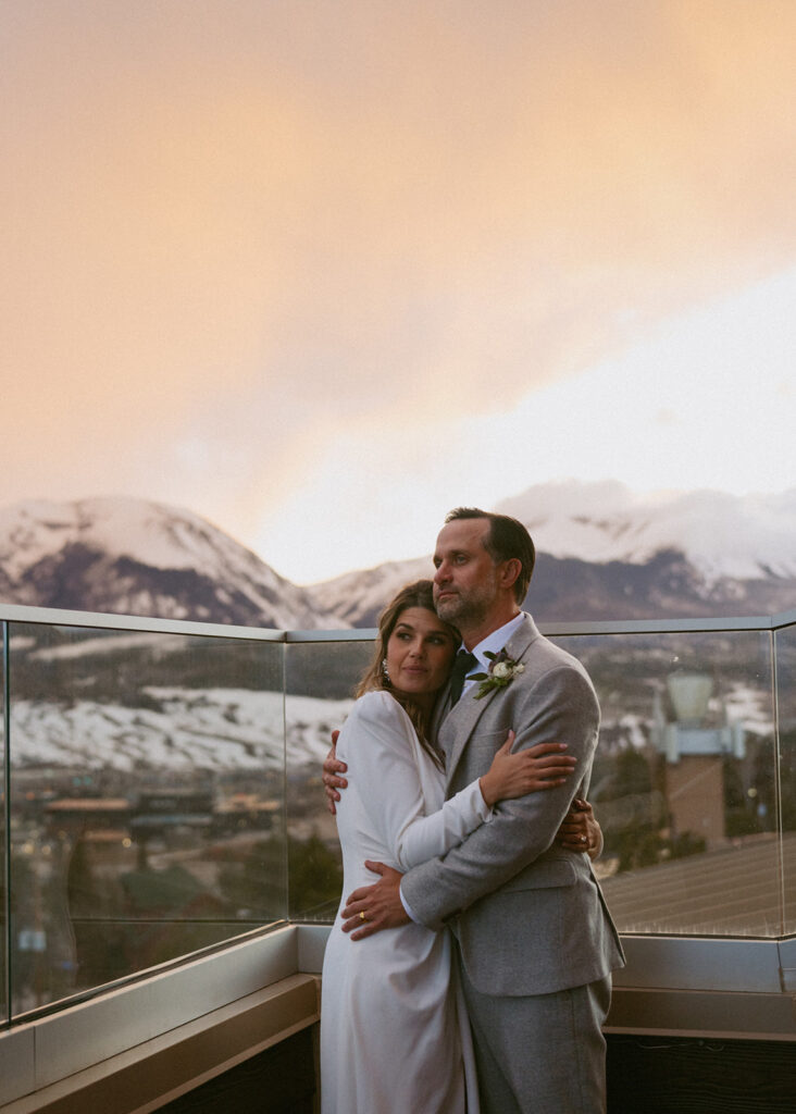 picture of the newlyweds hugging during sunset