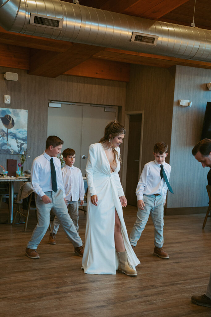 bride dancing with her sons 