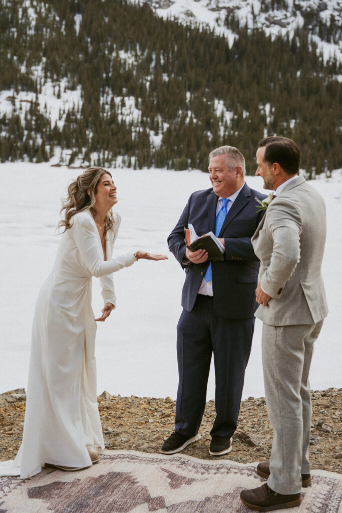 cute couple laughing with each other during their session