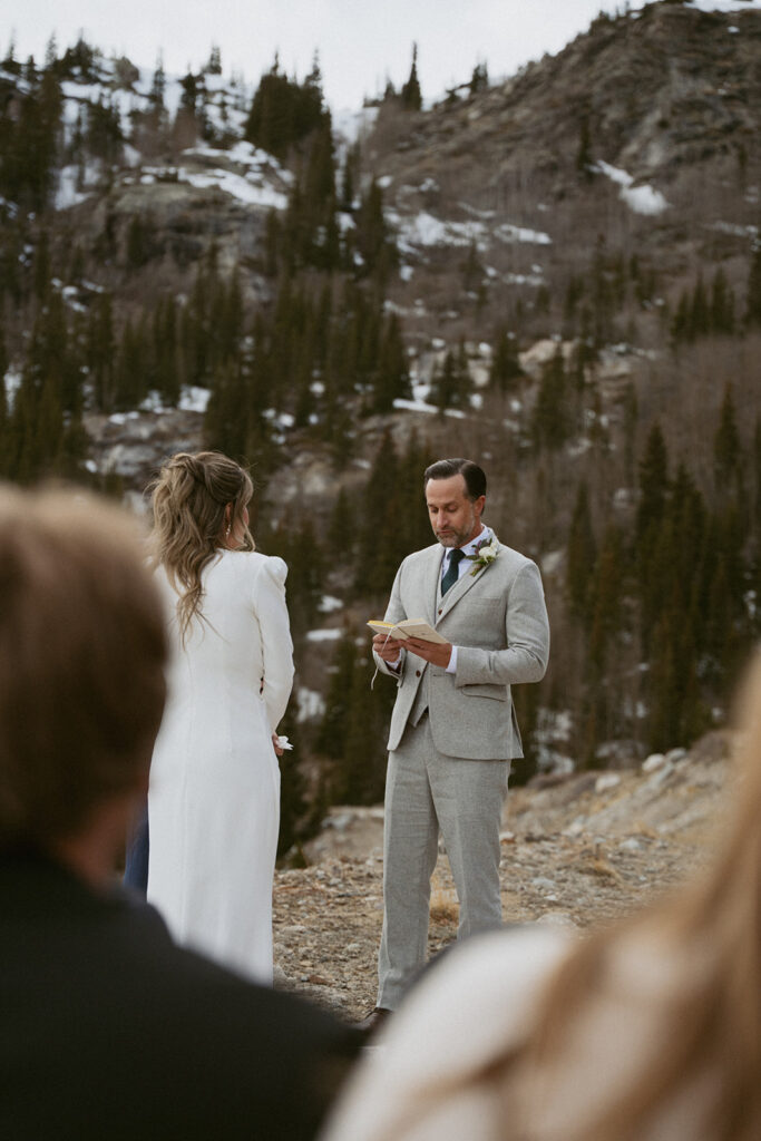 portrait of the groom reading his vows