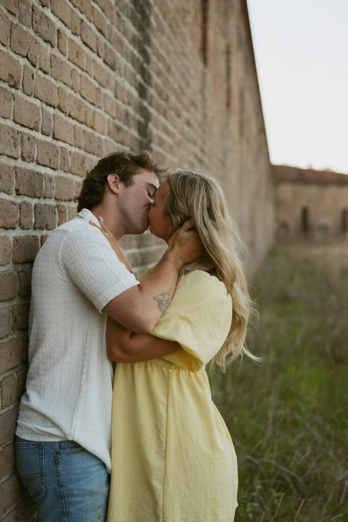 picture of the couple kissing during their photoshoot