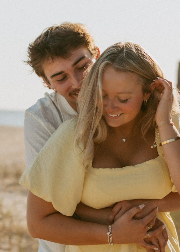 couple hugging during their photoshoot at the beach 