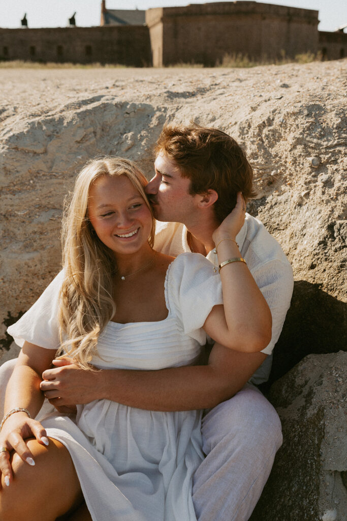 boyfriend kissing his girlfriend on the forehead 