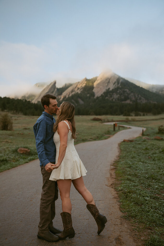 cute newly engaged couple kissing