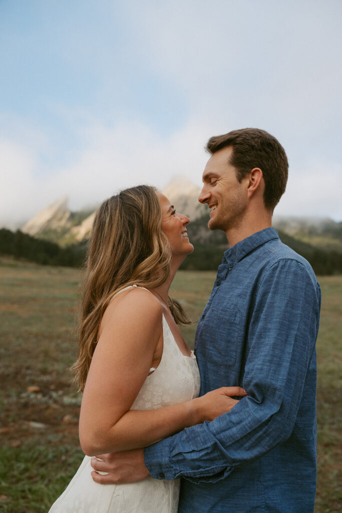 couple laughing with each other during their session
