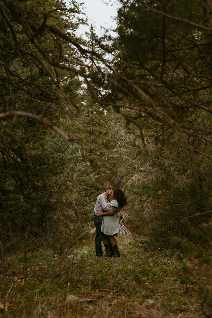 cute couple kissing during their adventurous photoshoot
