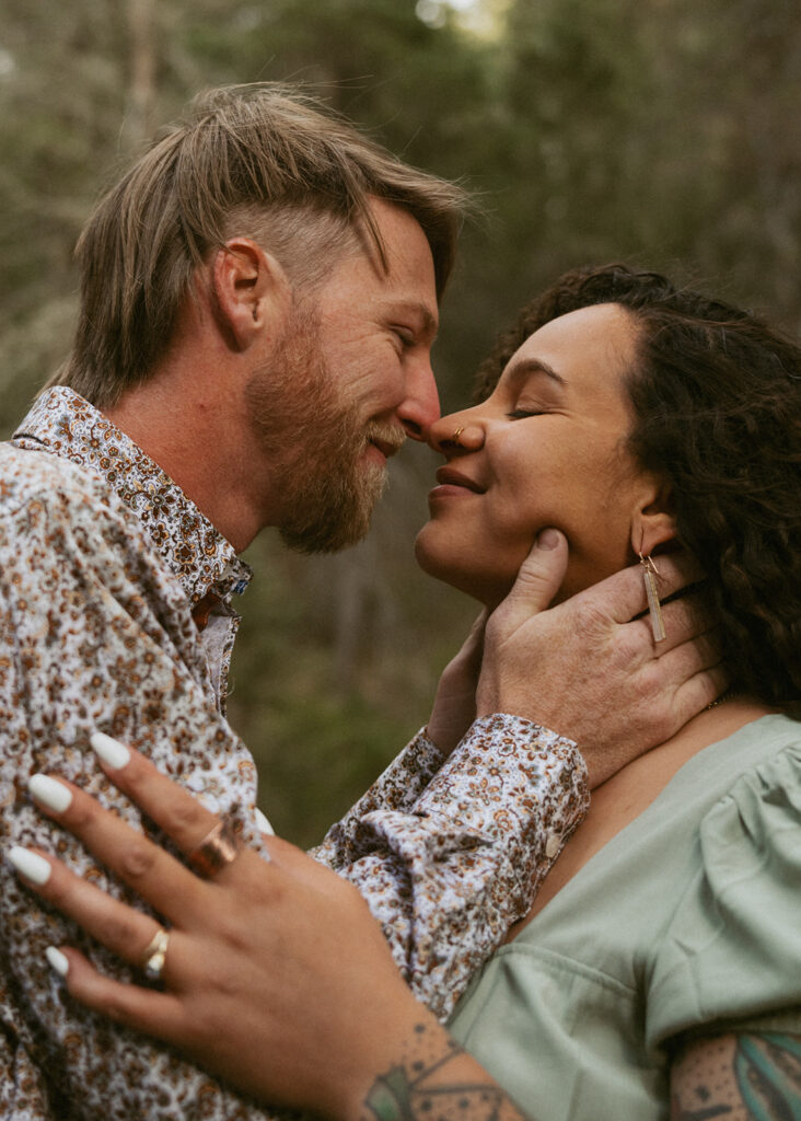 cute picture of the couple smiling at each other during their session