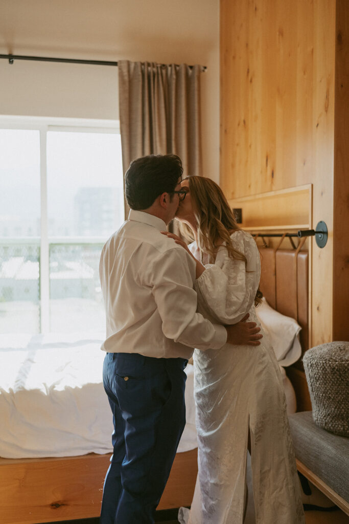 bride and groom kissing before their ceremony