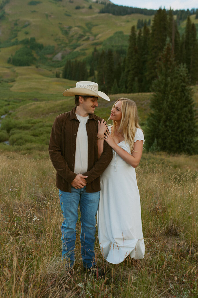 cute picture of the newly engaged couple playing during their photoshoot