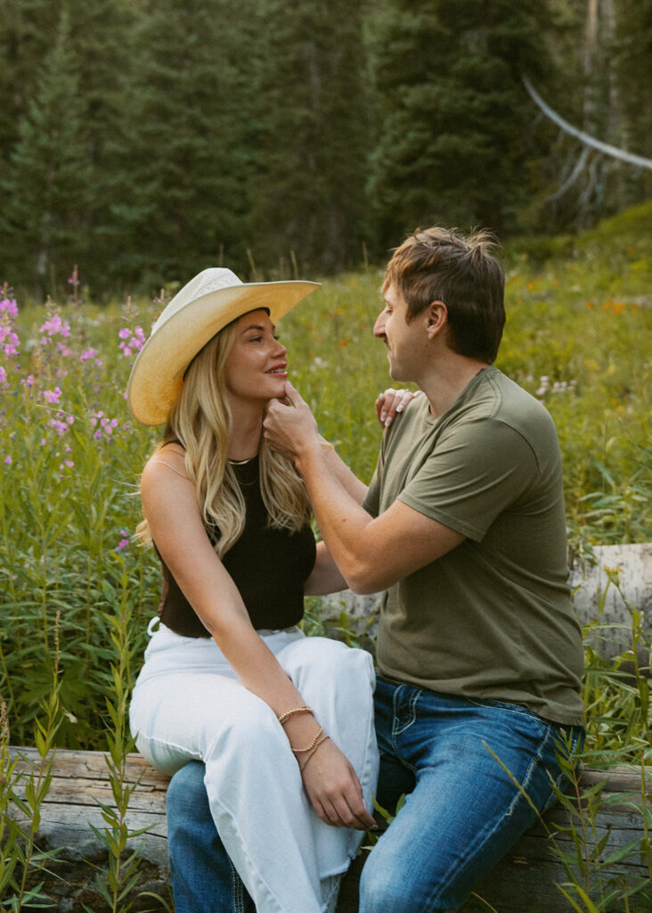couple smiling at each other during their photoshoot