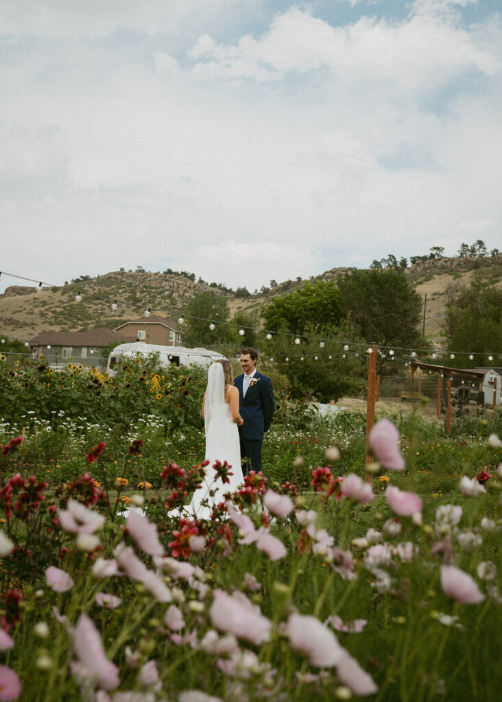 portrait of the bride and groom holding hands