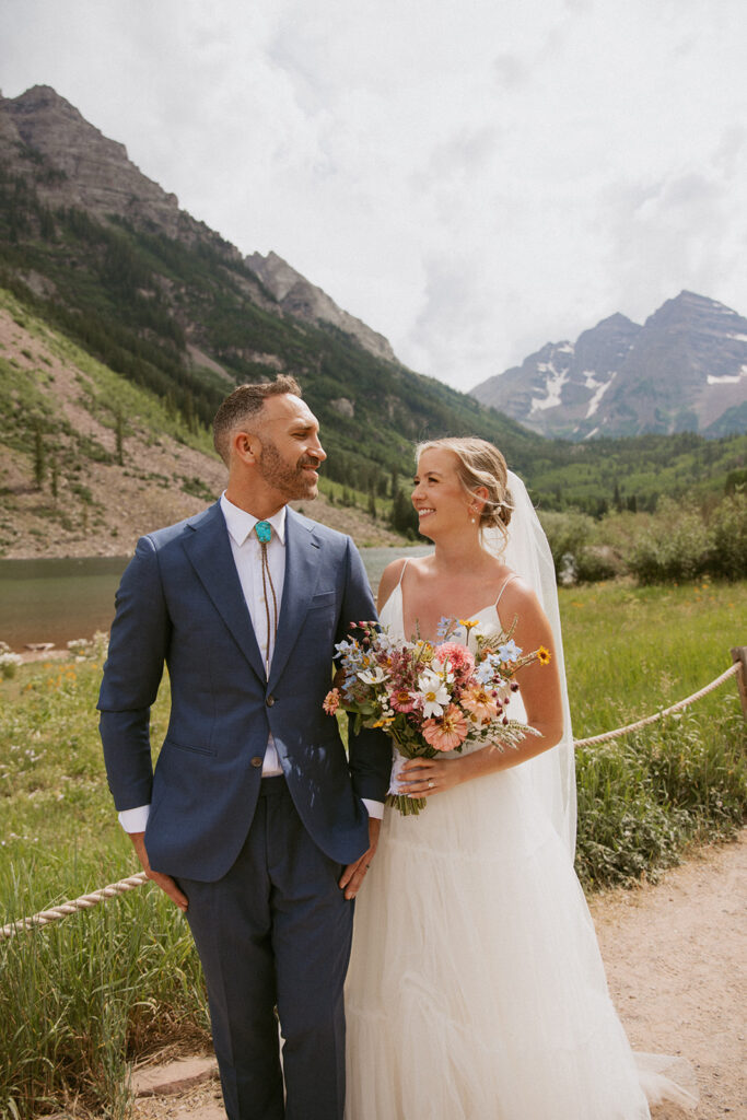 picture of the bride and groom smiling at each other