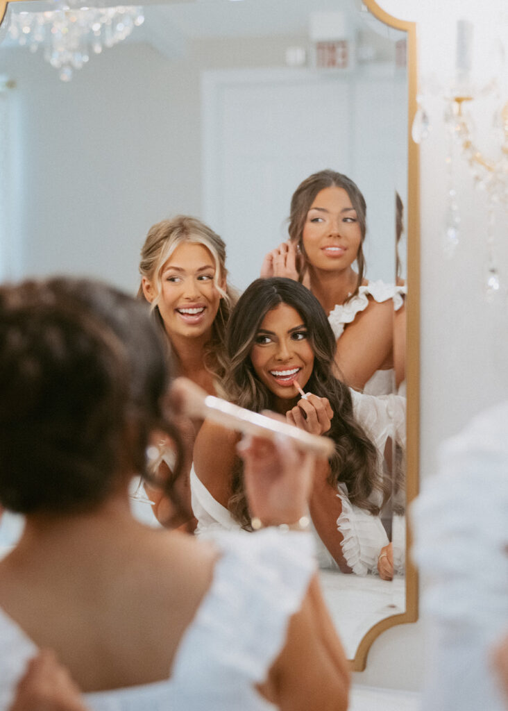 bride and her bridesmaids getting ready