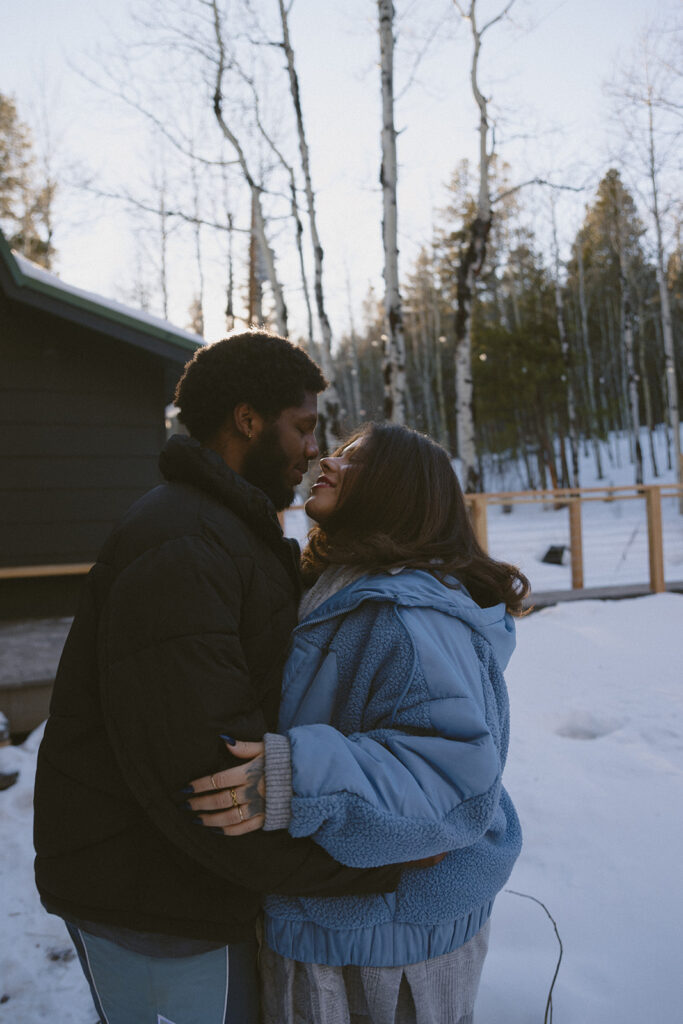 cute couple smiling at each other during their session