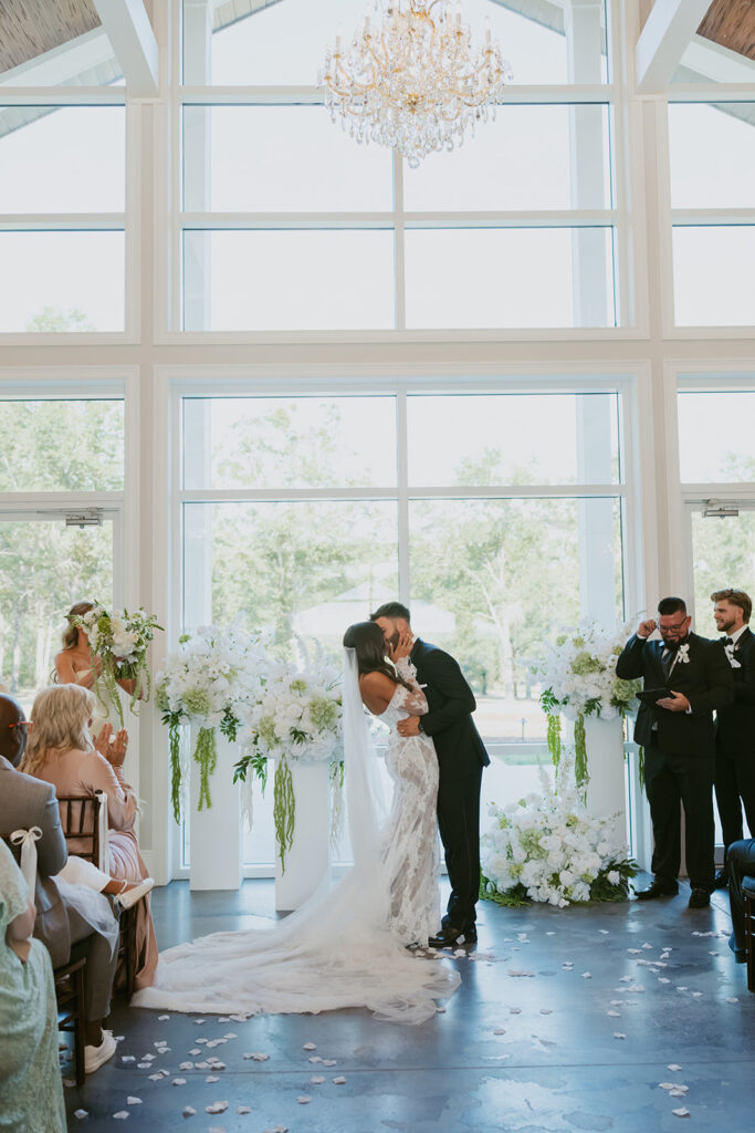 Couple kissing after their wedding ceremony
