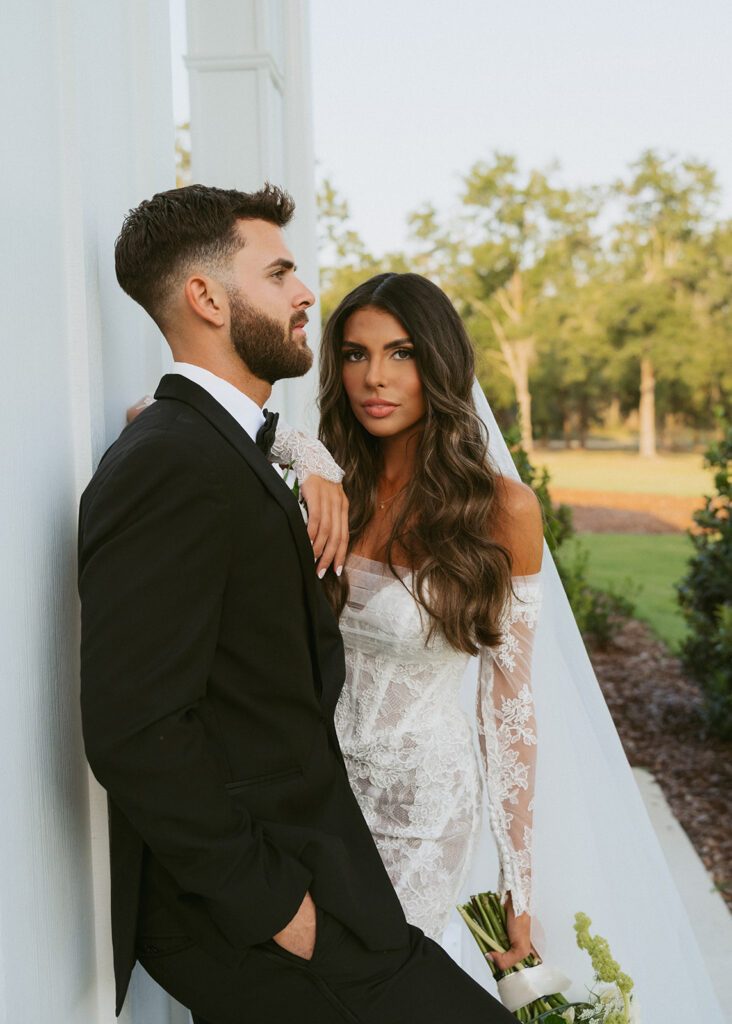 Couple posting for the camera during their bridal session