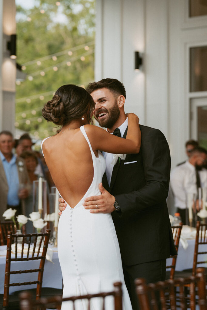 Couple smiling at each other during their first dance