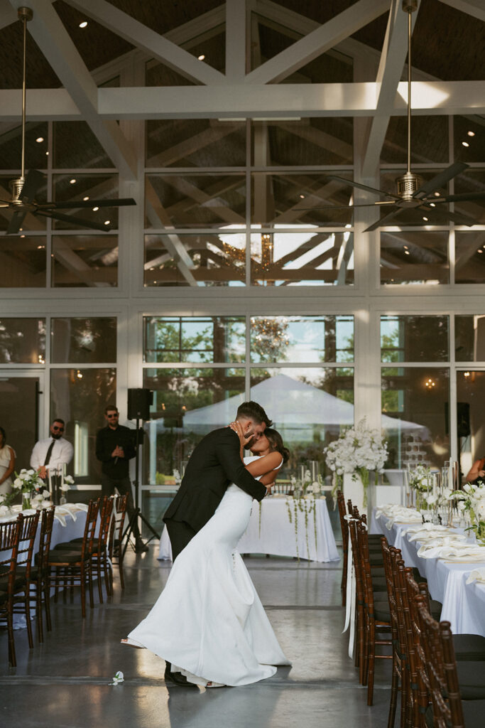 Cute couple kissing at their wedding reception
