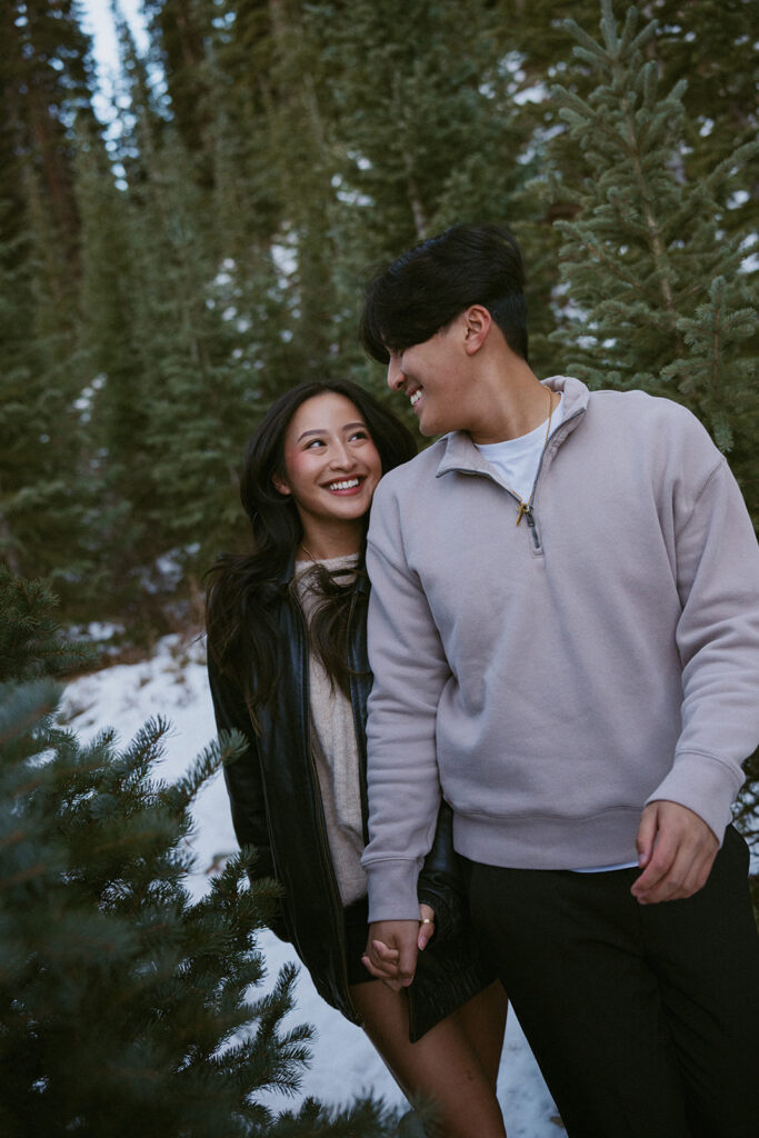 cute picture of the couple laughing with each other during their photoshoot