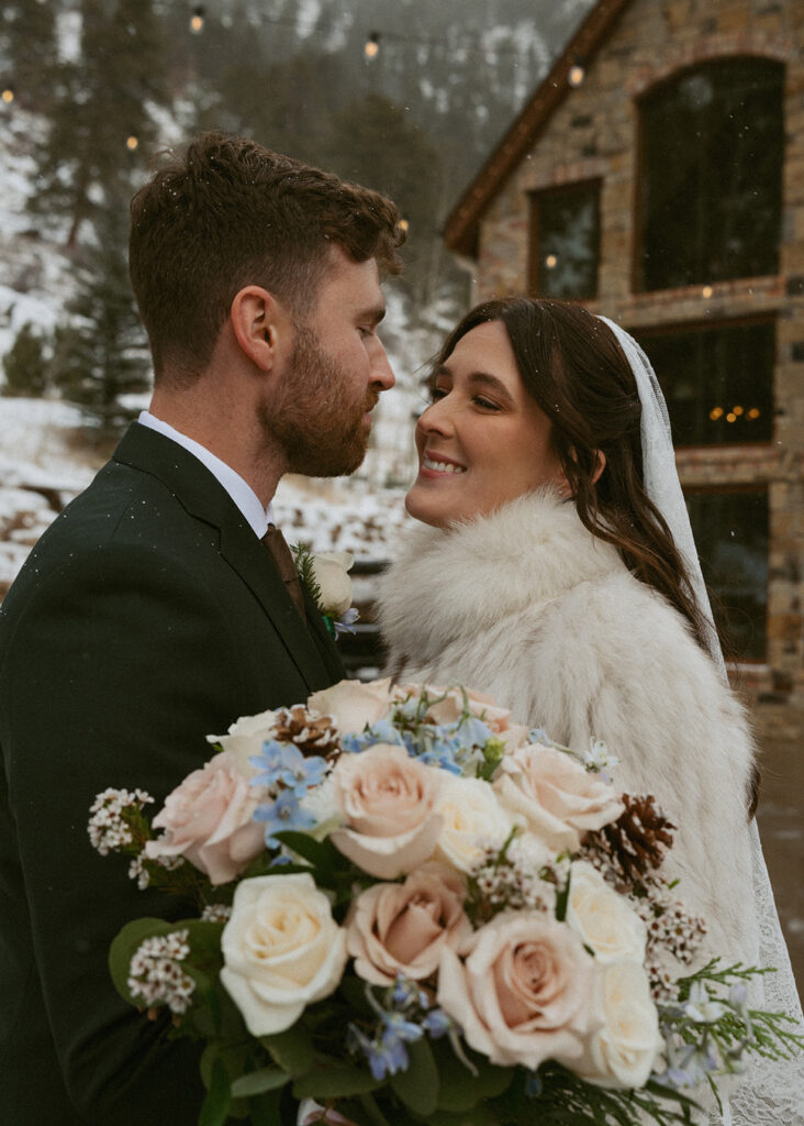 cute picture of the bride and groom smiling at each other
