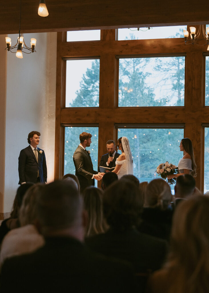 cute picture of the bride and groom, holding hands during their wedding ceremony