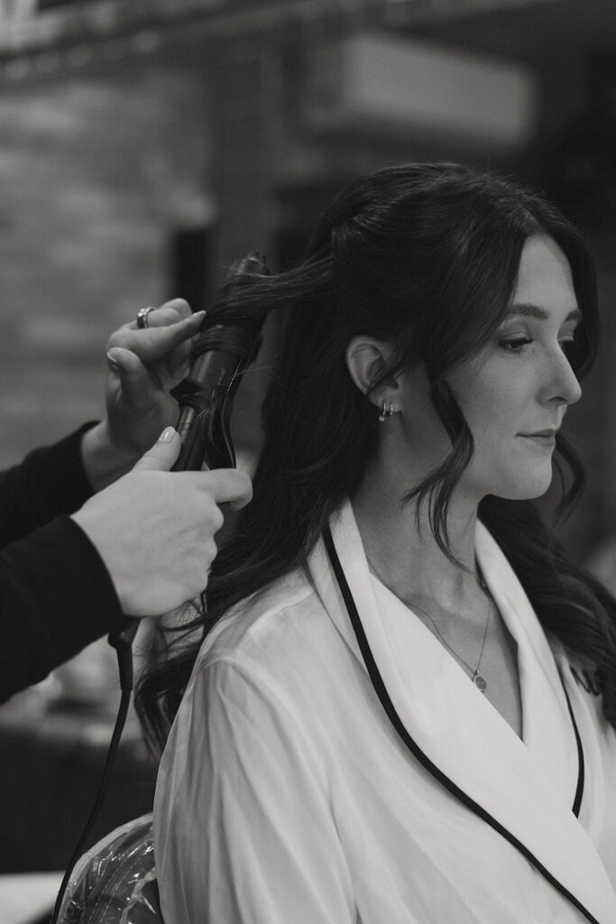 cute picture of the bride getting her hair done