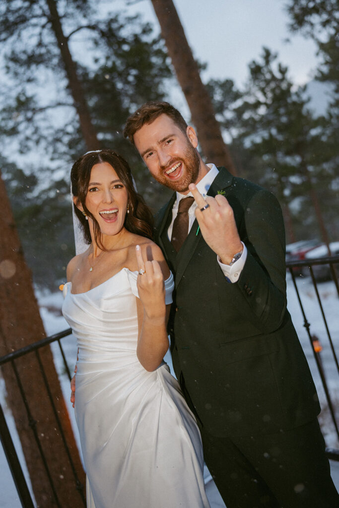 cute picture of the newlyweds showing their wedding rings