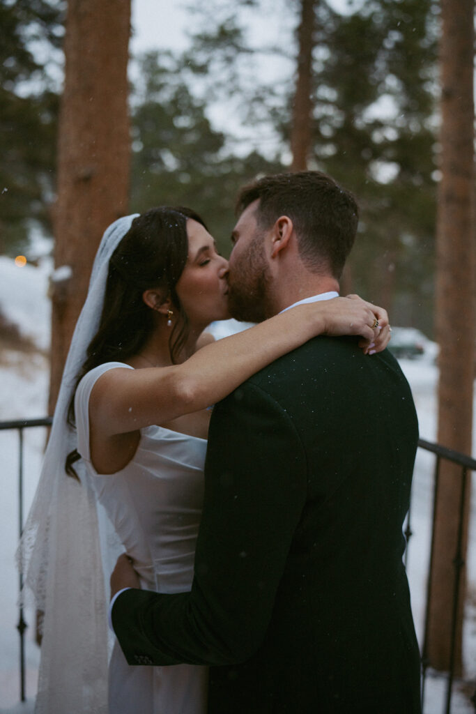 cute portrait of the newly married couple kissing