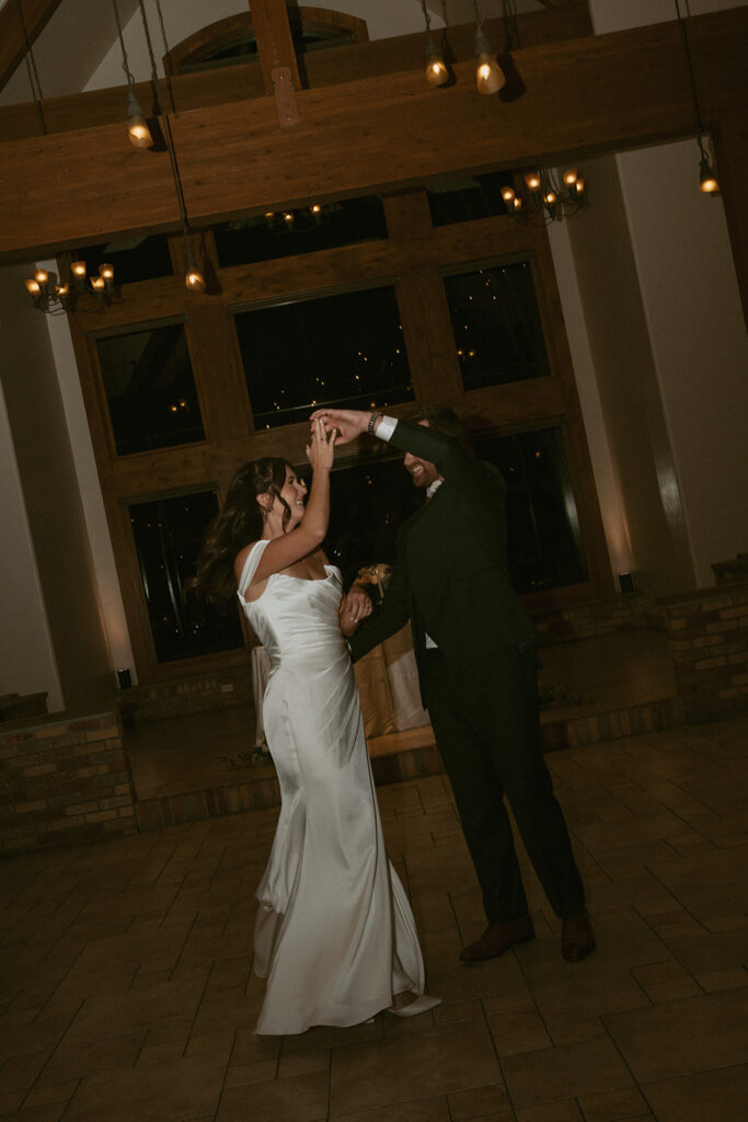 cute picture of the newlyweds at their first dance at their wedding reception