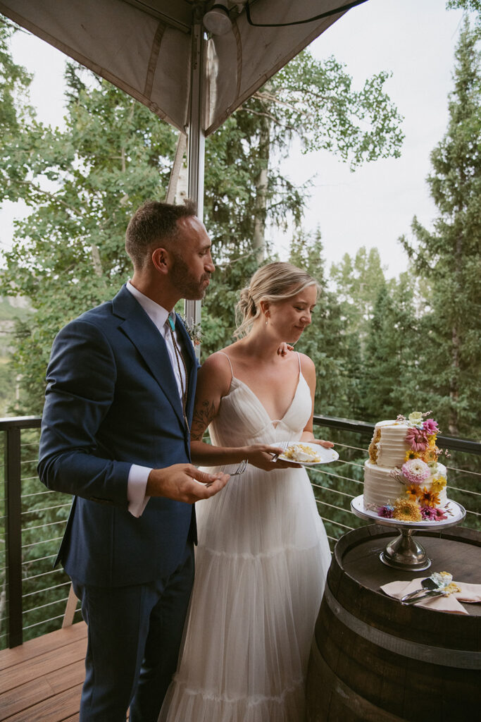 cute picture of the newlyweds cutting their wedding cake