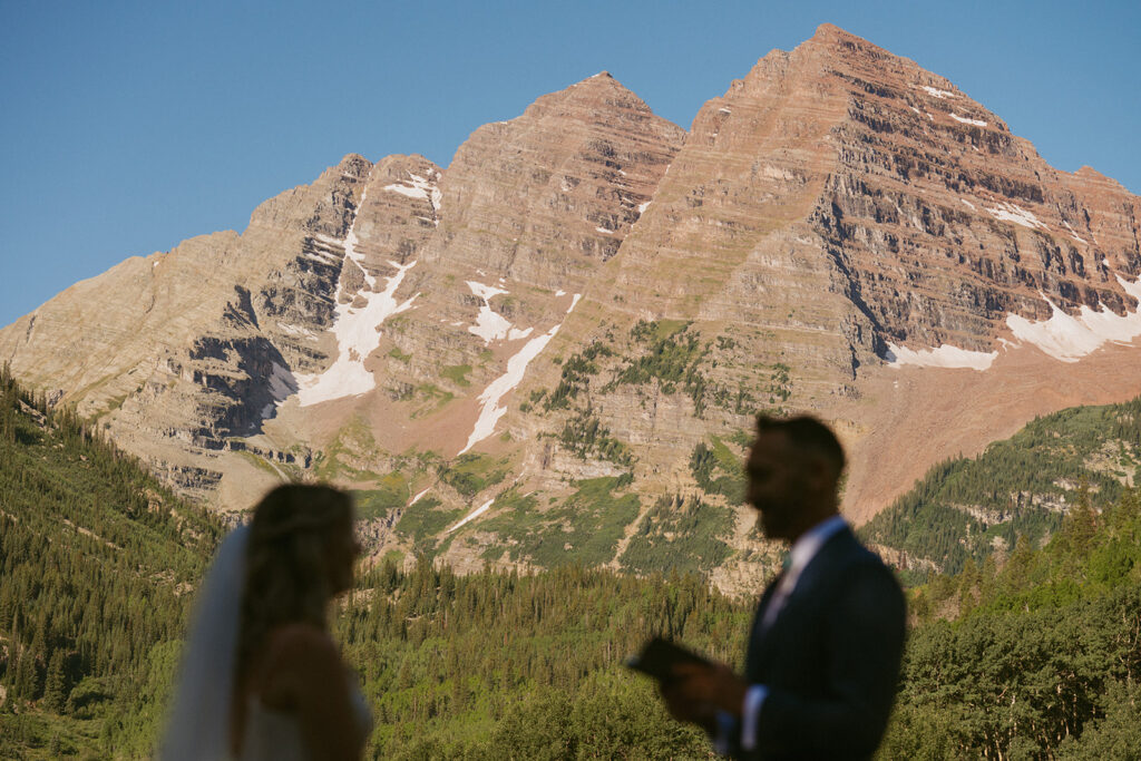 bride and groom at dream elopement reading their vows