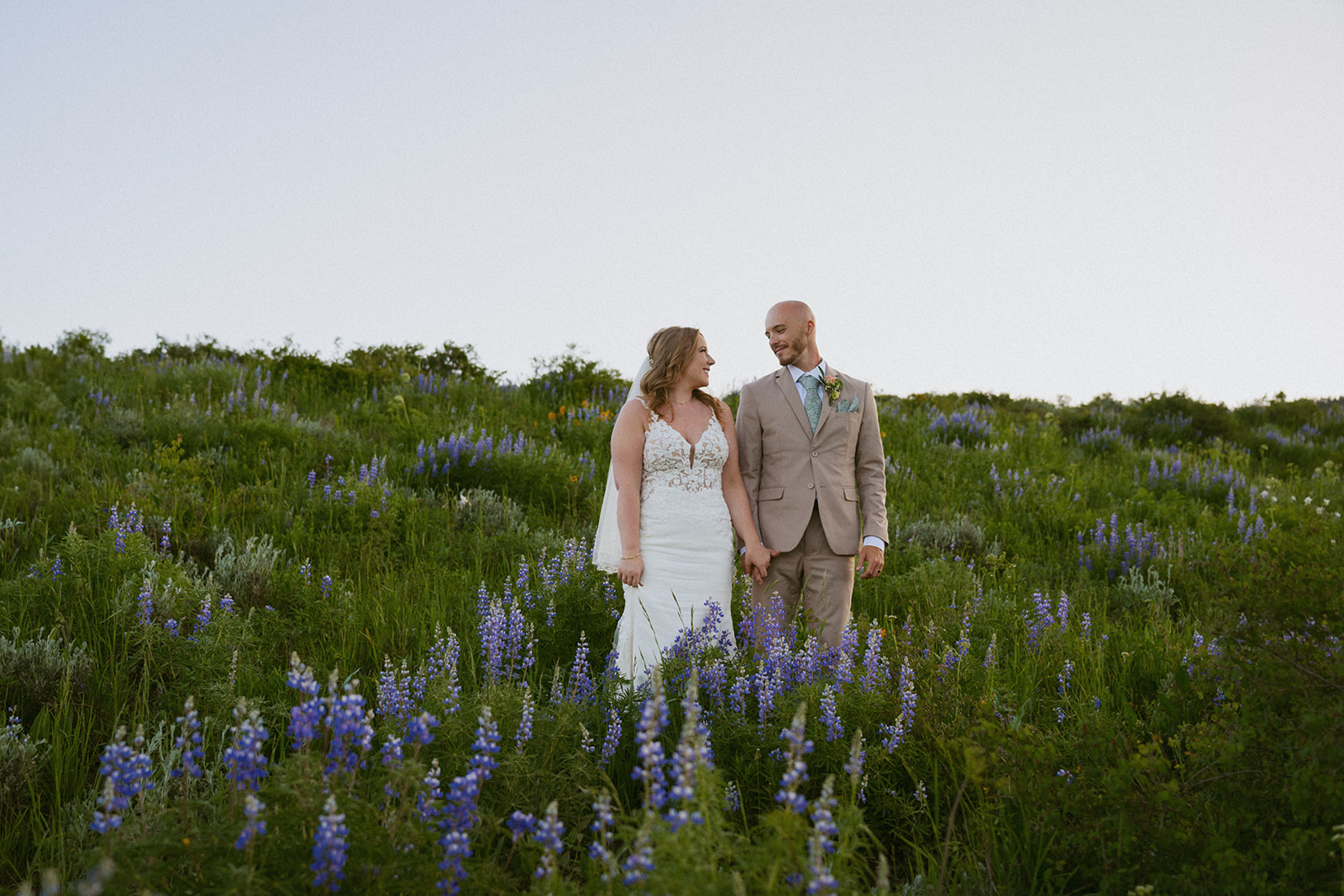 cute picture of the bride and groom holding hands