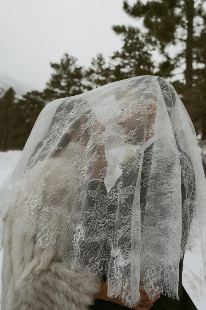 cute picture of the bride and groom at their winter wedding