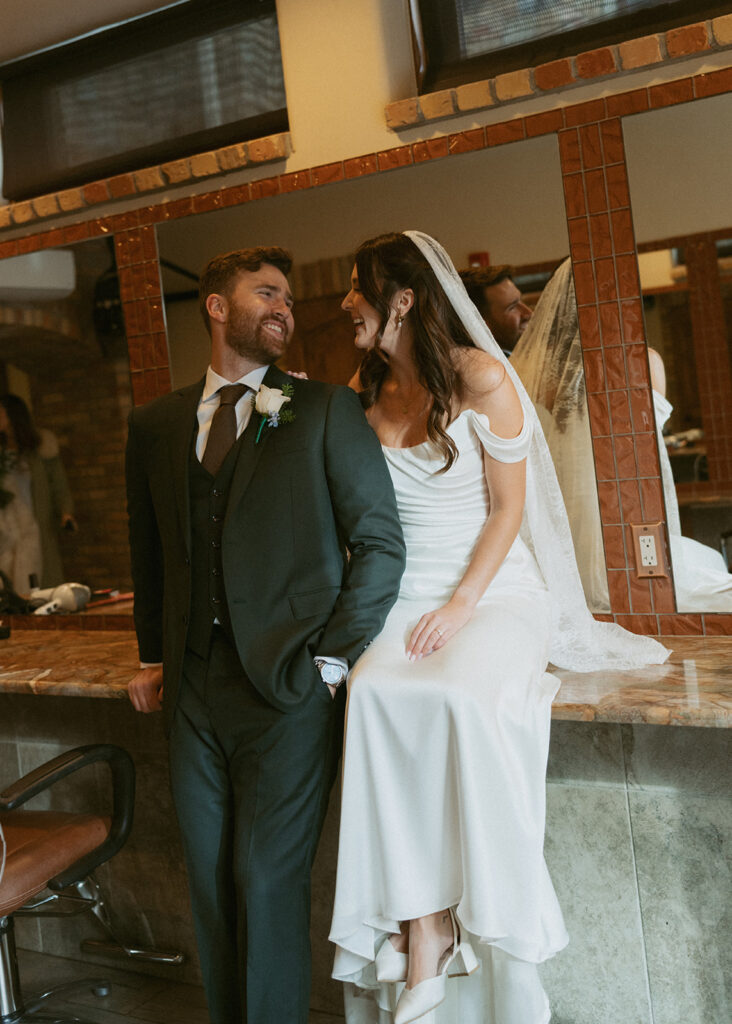 cute picture of the newlyweds smiling at each other