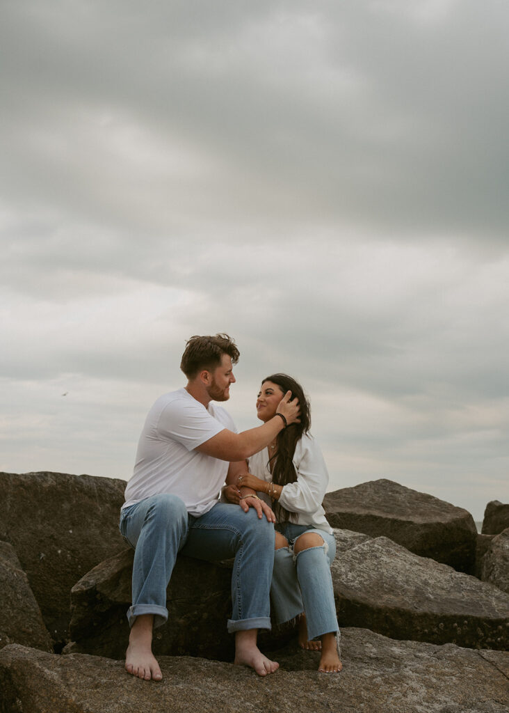 couple smiling at each other during their photoshoot