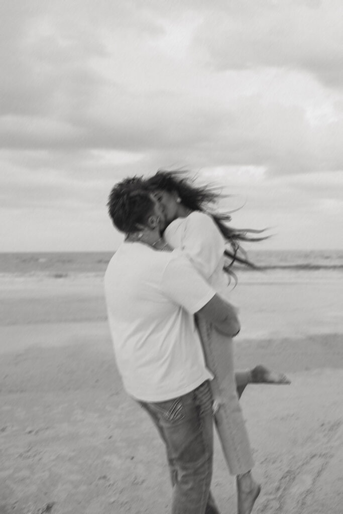 couple dancing at the beach during their photoshoot