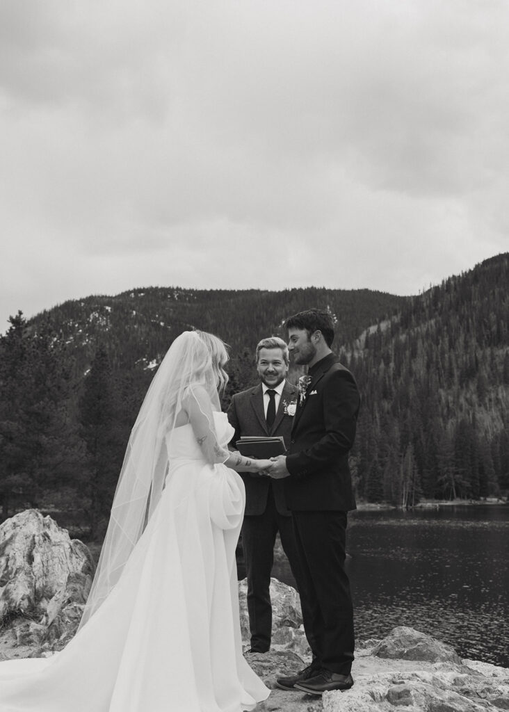 bride and groom holding hands during their ceremony
