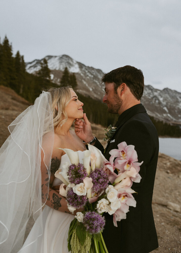 cute picture of the bride and groom smiling at each other