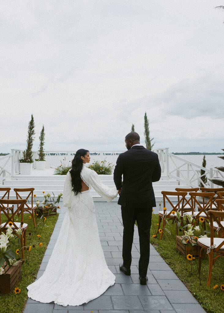 Picture of the bride and groom holding hands
