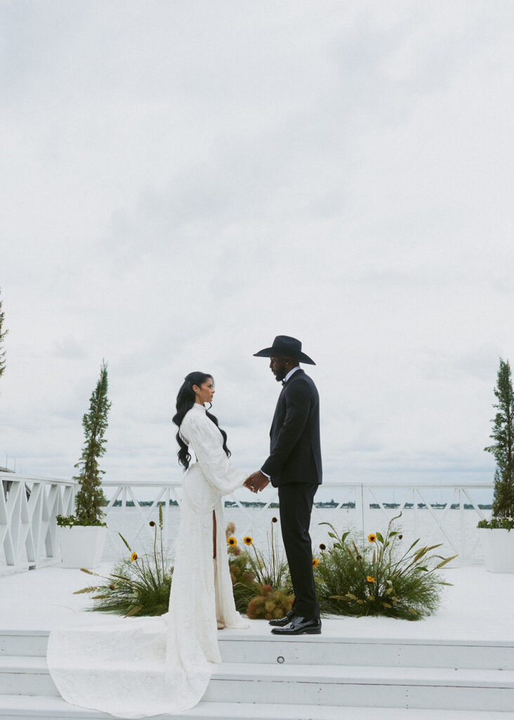 bride and groom holding hands during their ceremony