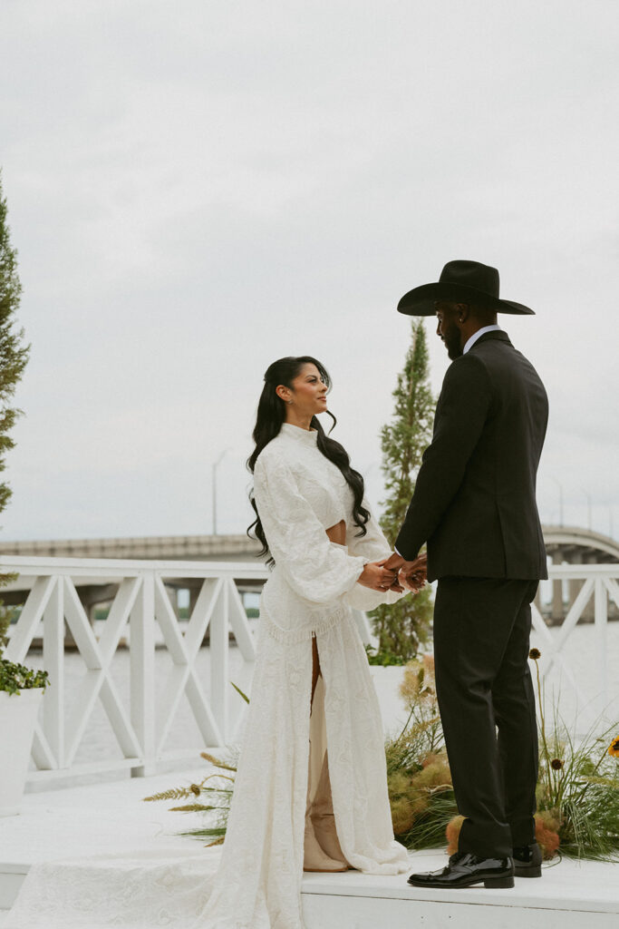 cute picture of the newlyweds holding hands