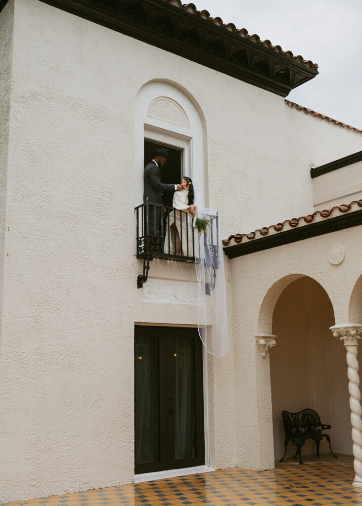 groom kissing the bride on the cheek