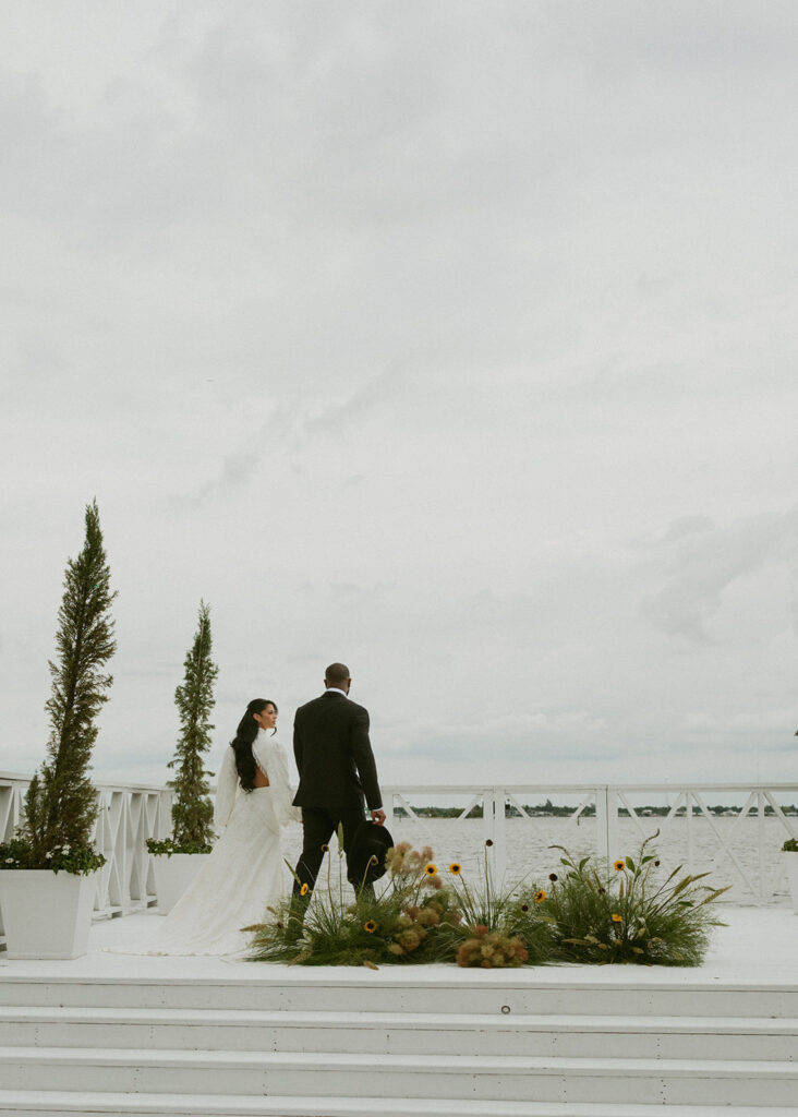 cute picture of the newlyweds holding hands