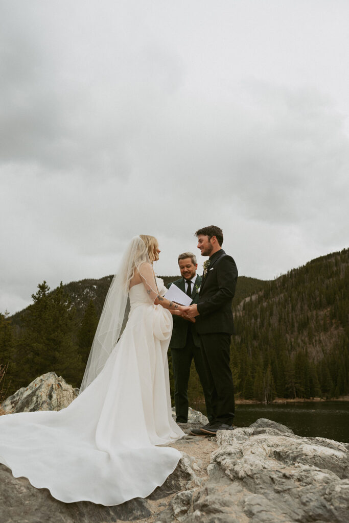 bride and groom holding hands during their ceremony