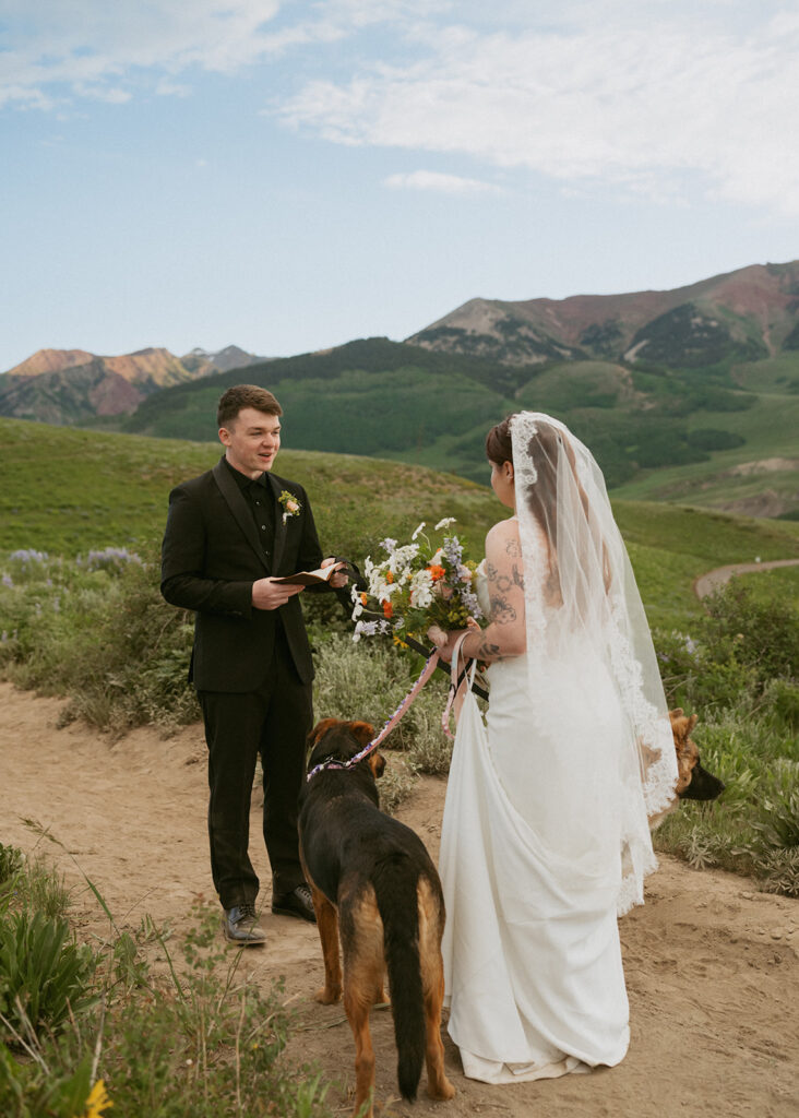 Bride and groom holding hands during their ceremony