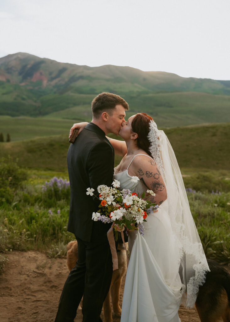 cute picture of the newlyweds kissing after their elopement ceremony