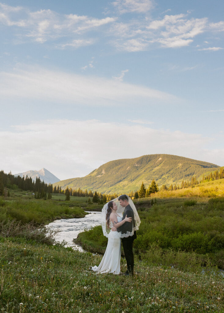 groom kissing the bride on the cheek